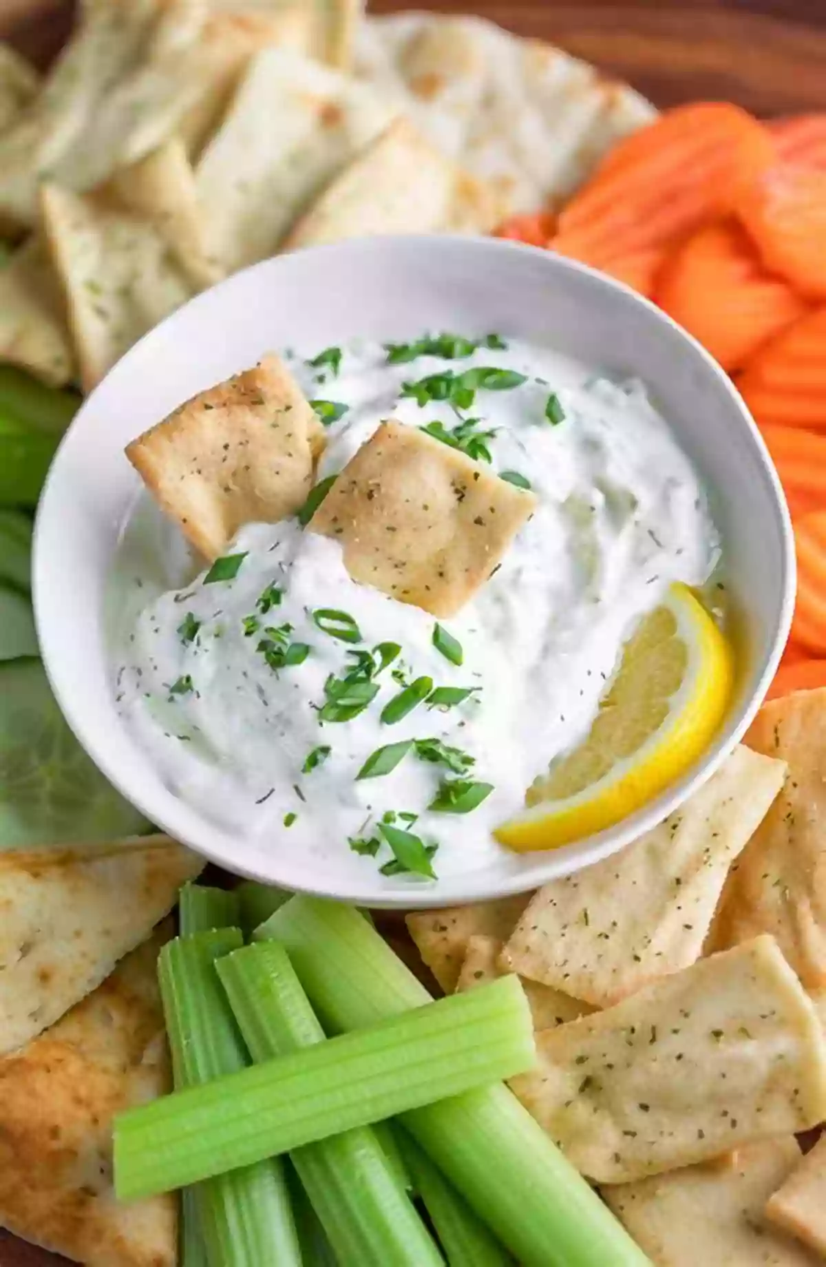 A Bowl Of Creamy And Refreshing Tzatziki Dip With Pita Bread The Delicious Homemade Greek Food: The Greek Recipes Collection You Will Love