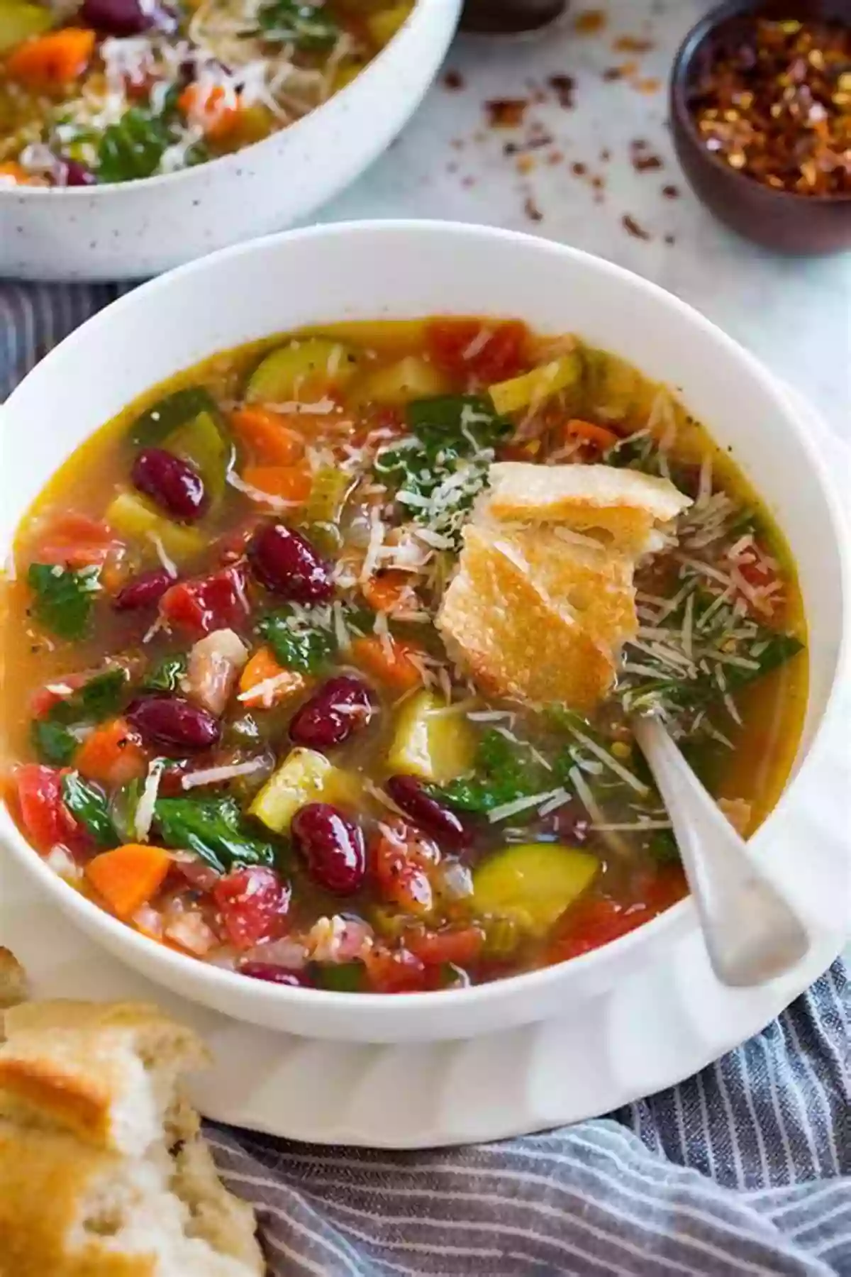 A Bowl Of Traditional Italian Minestrone Soup Garnished With Fresh Parmesan Cheese Soups For Your Soul: Please Everyone At The Table Become All Time Favorites: Soups Recipes Healthy