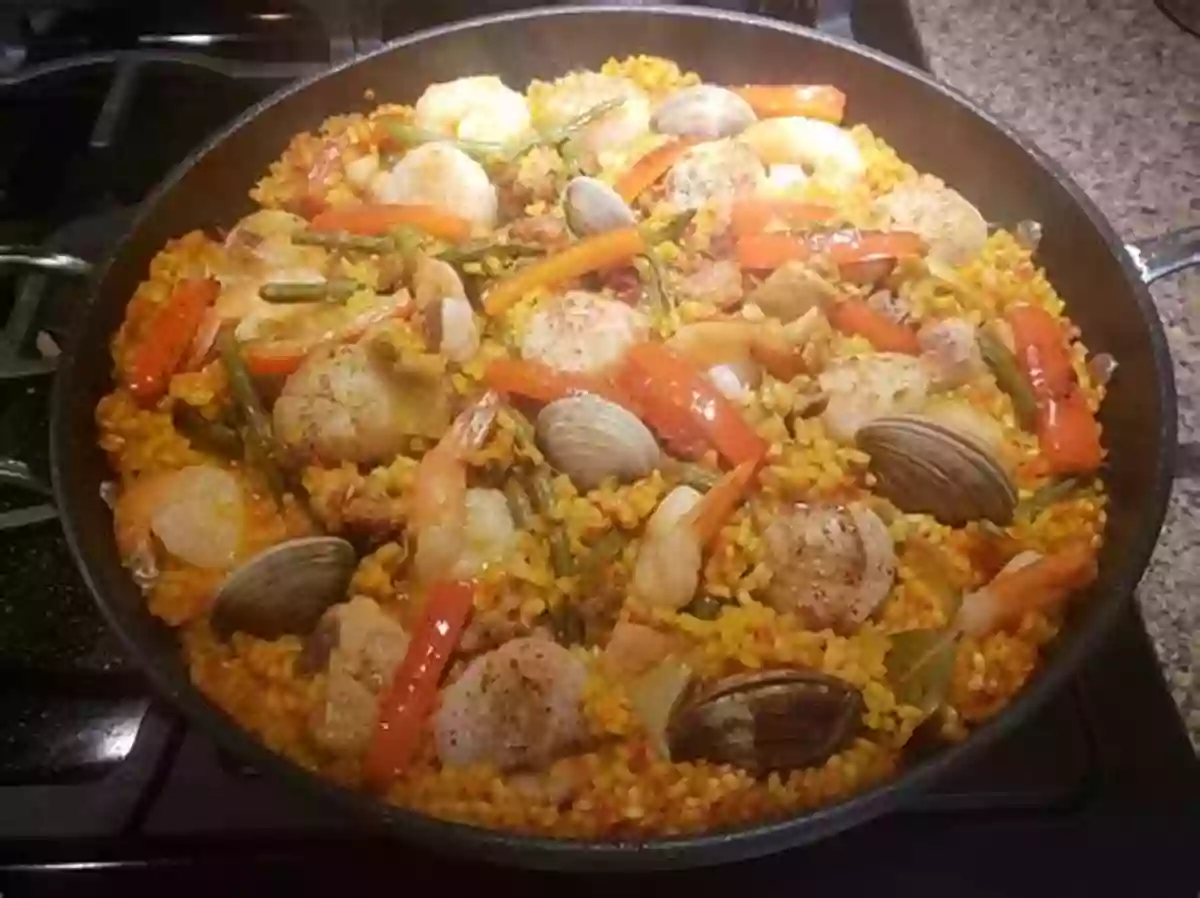 A Delightful Plate Of Paella, A Spanish Rice Dish With Various Ingredients Such As Seafood And Saffron – A Bold Representation Of Spanish Cuisine 365 Amazing World Cuisine Recipes: Greatest World Cuisine Cookbook Of All Time