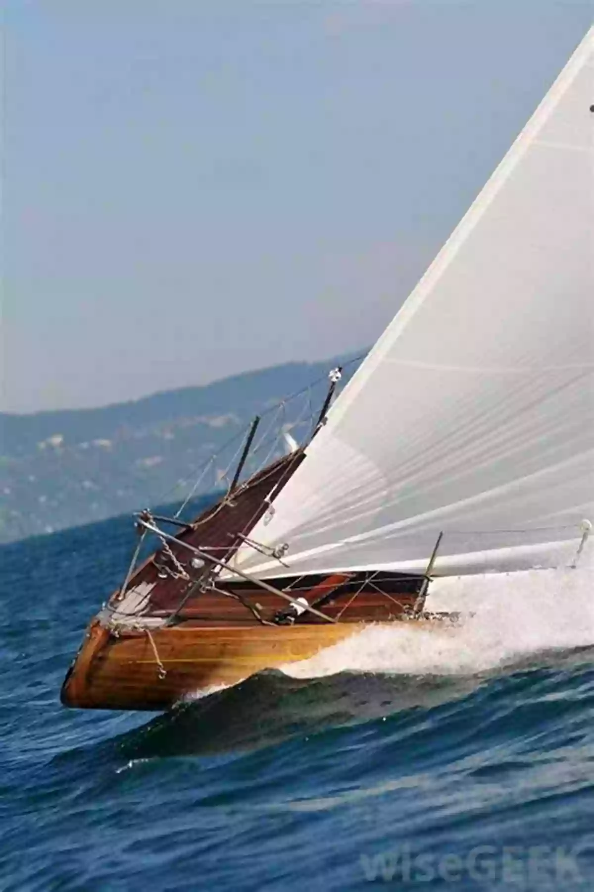 A Group Of Sailboats Cutting Through The Waves Under A Clear Blue Sky, Representing The Ultimate Experience Of Voyaging Under Sail. How To Sail Around The World: Advice And Ideas For Voyaging Under Sail