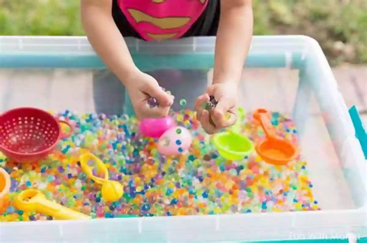 A Picture Of A Child Playing With A Sensory Bin Filled With Colored Water Beads The Alphabet Book: With Clear Pictures To Teach Your Child Baby Children S Toddler Kids