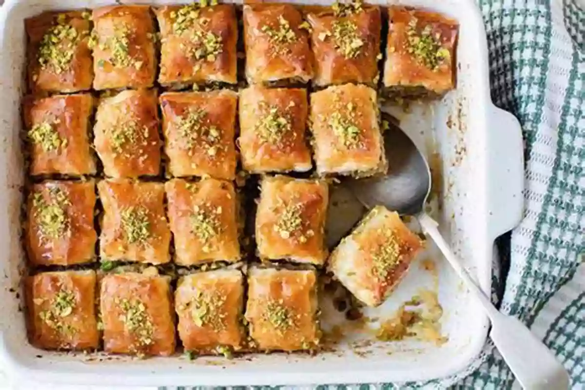 A Plate Of Golden Baklava Slices Topped With Crushed Pistachios The Delicious Homemade Greek Food: The Greek Recipes Collection You Will Love