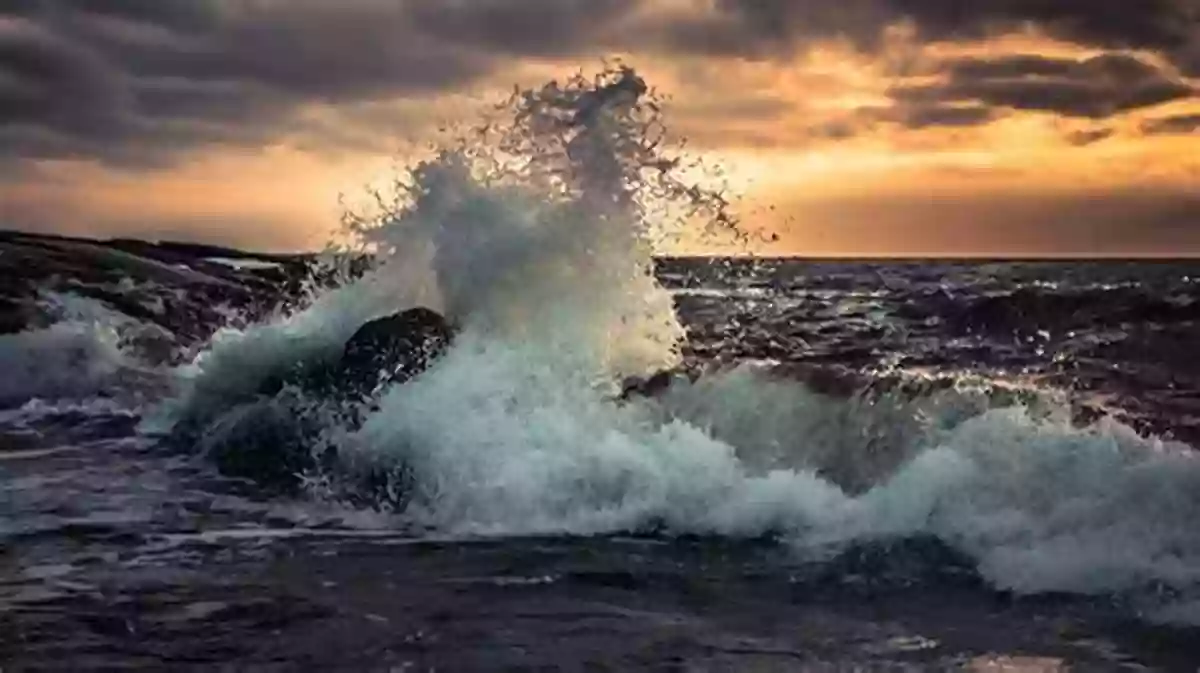 A Powerful Ocean Wave Crashes Against Coastal Rocks, Creating A Breathtaking Spectacle. Ocean Waves And Oscillating Systems: Linear Interactions Including Wave Energy Extraction (Cambridge Ocean Technology 8)