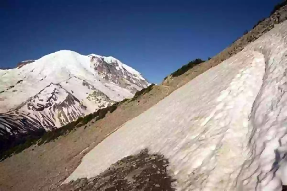 A Snow Covered Mountain Peak With A Treacherous Trail Leading To The Top Haunted Lighthouse And Blizzard Peak (The Mystery Worldwide Adventures 2)