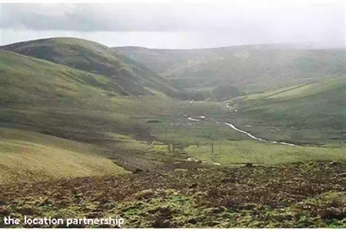 A Stunning Scottish Landscape With Rocky Cliffs, Rolling Hills, And A Vibrant Green Valley Geology And Landscapes Of Scotland