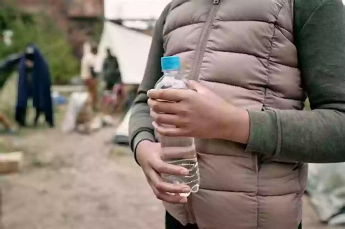 Act Of Kindness At The Border: A Young Girl Offers A Bottle Of Water To A Migrant Child The Notebook Keeper: A Story Of Kindness From The Border