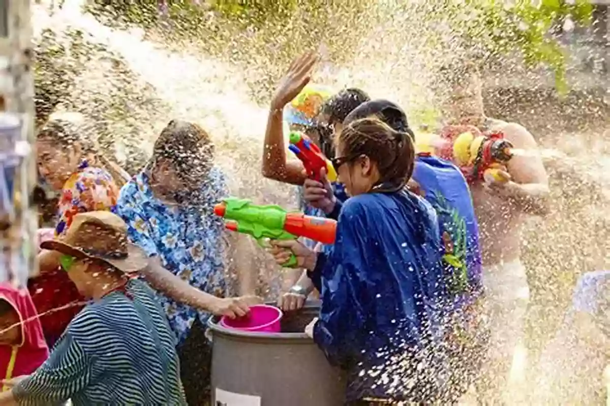 People Splashing Water On Each Other During Songkran In Thailand New Year Traditions Around The World (World Traditions)