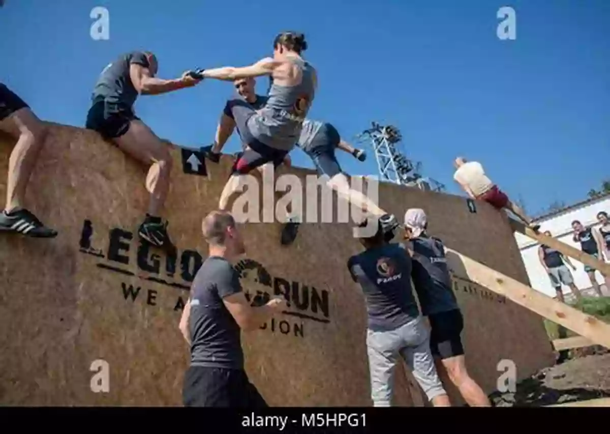 Teamwork In Action As Participants Lift Each Other Over An Obstacle Mountain Mission (Race The Wild #6)